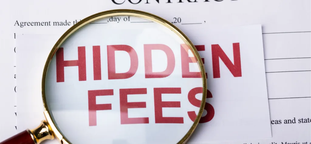 Magnifying glass highlighting “Hidden Fees” on a contract, representing transparent medical record retrieval fees, including provider fees.